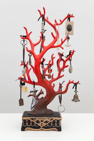 Piece of coral used as a rack to hang jewelry and household objects