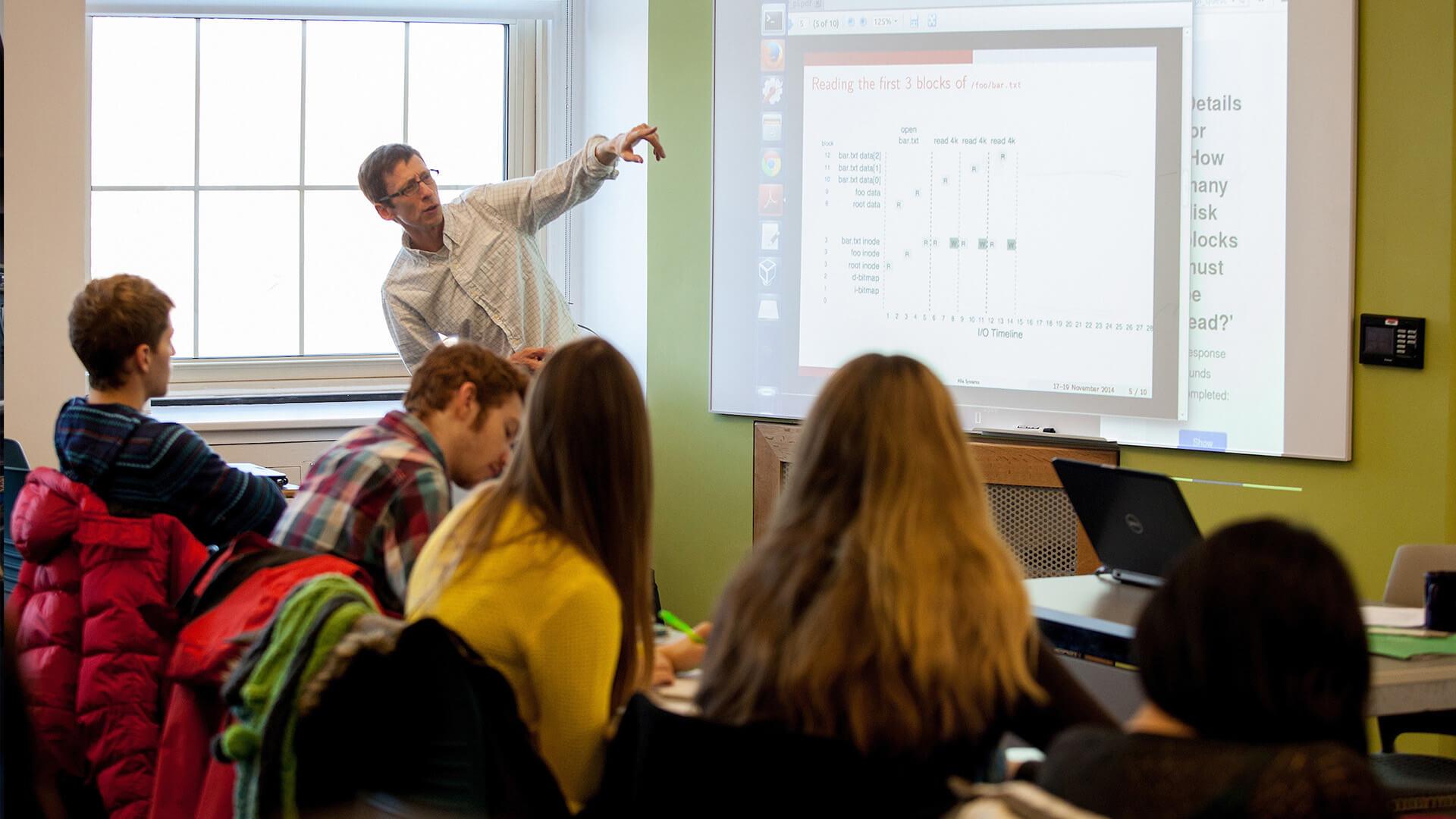 Professor Joel Sommers instructs a classroom of Colgate students.