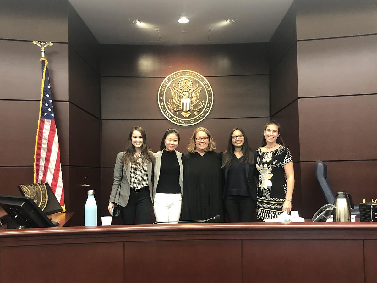 Students job shadowing judge Elizabeth Wolford ’89 in court