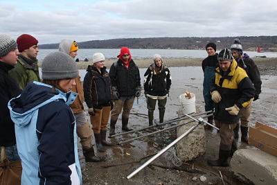 GEOG 401 Senior Seminar collecting a sediment core on the south end of Cayuga Lake, NY