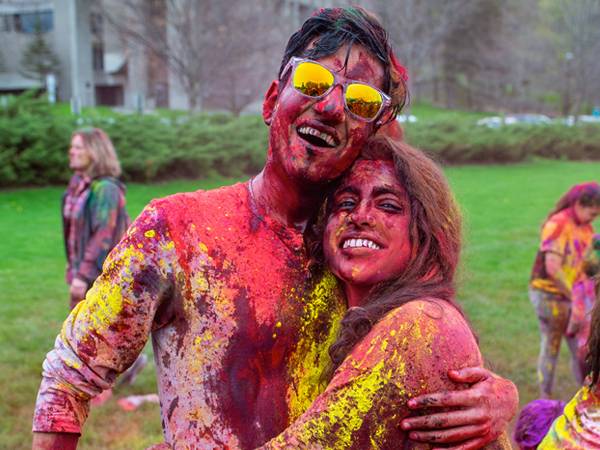 Colgate students participate in the annual Holi Celebration on Whitnall Field.
