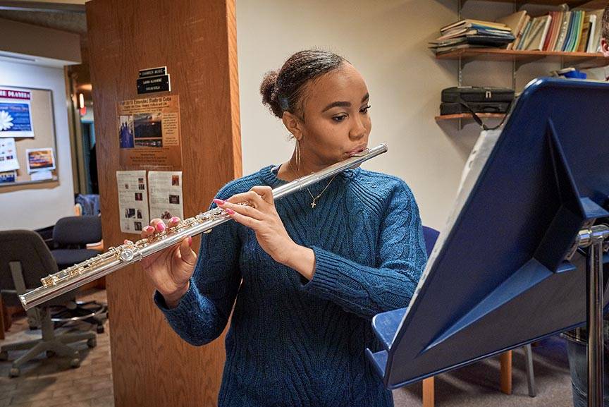 Student practicing the flute