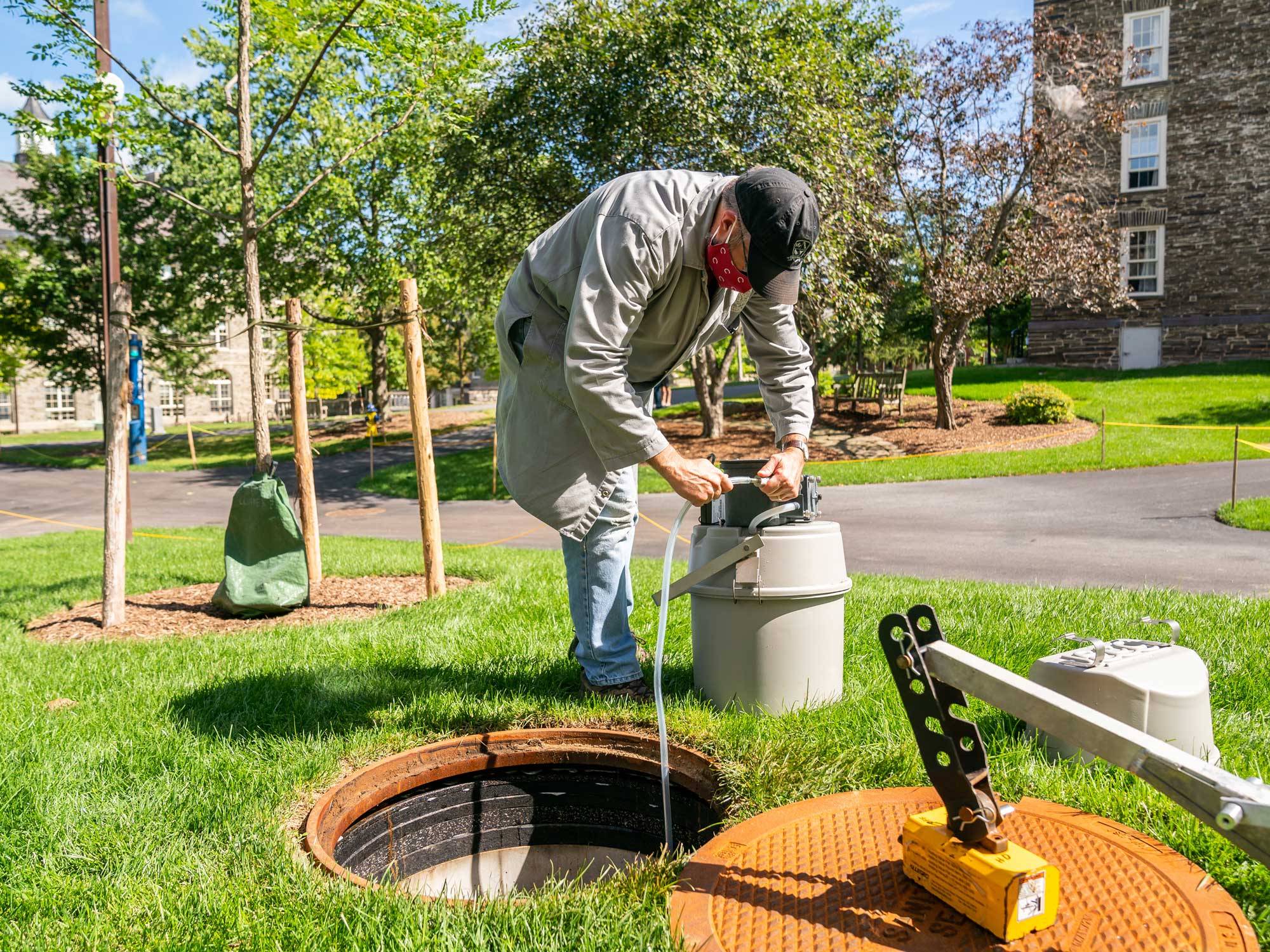 Professor Holm works at a wastewater collection site on campus. 