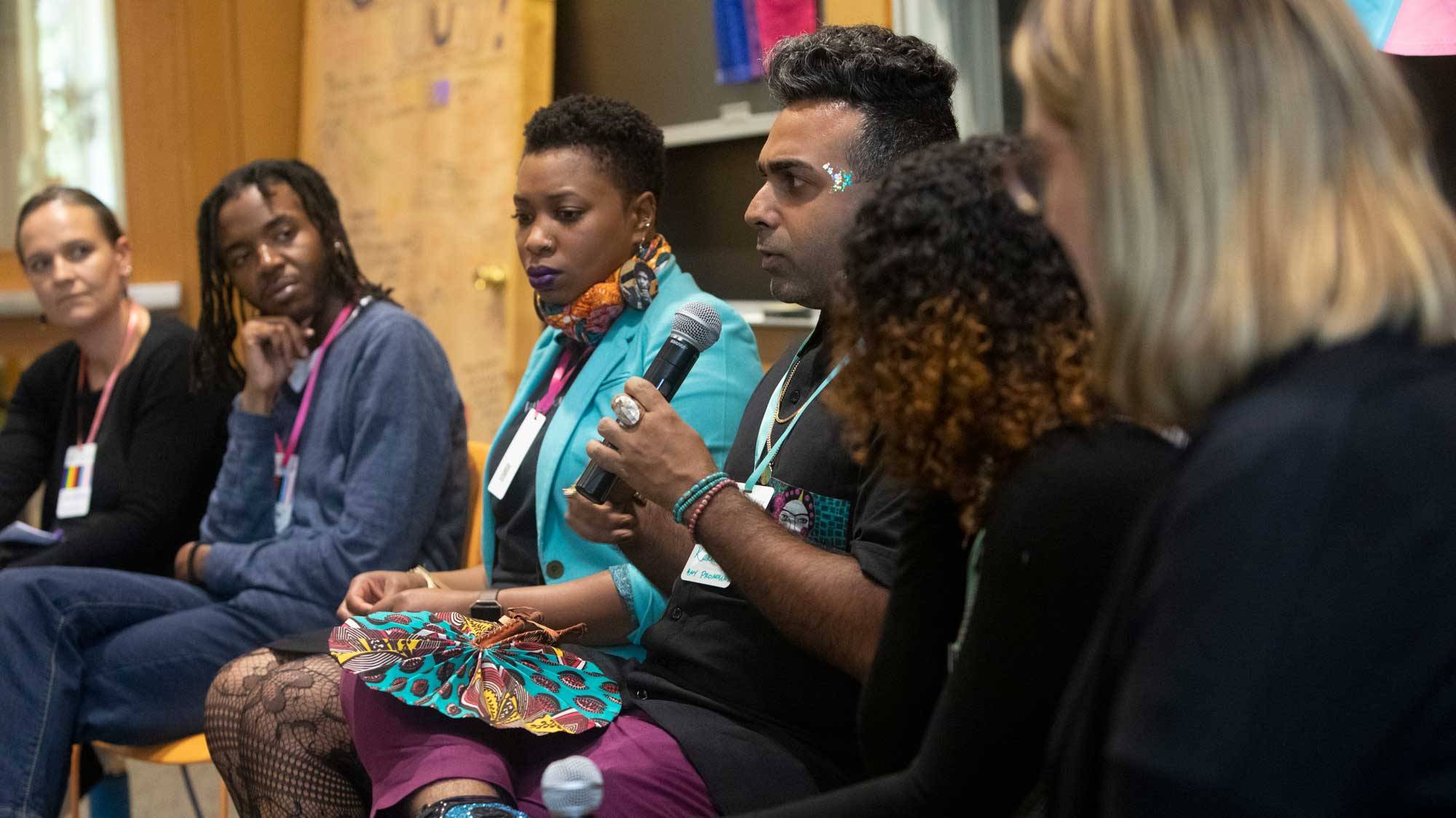 panelists engage in conversation during a celebration of LGBTQ Studies' 10th anniversary