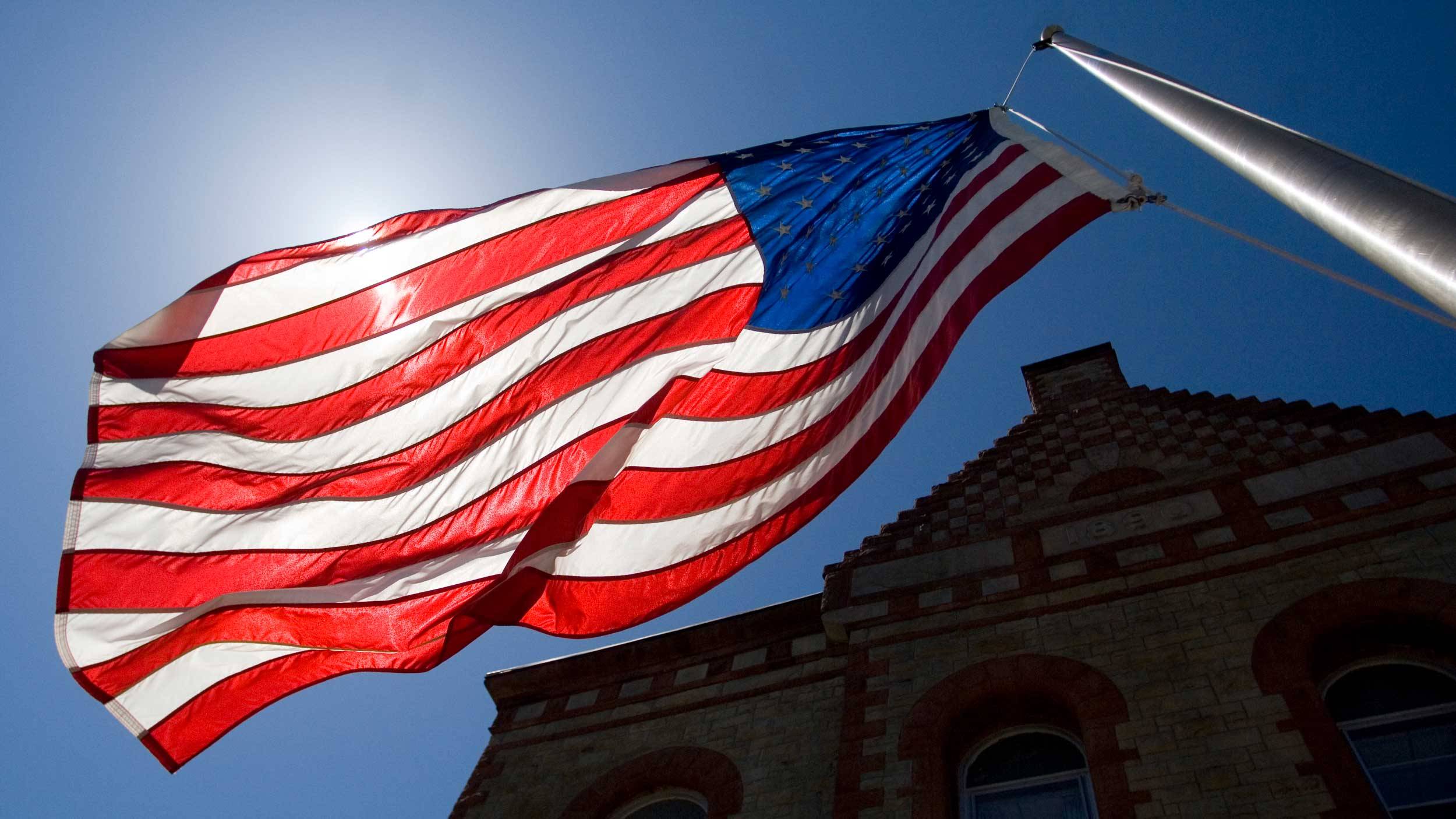 U.S. flag flies in front of James B. Colgate Hall