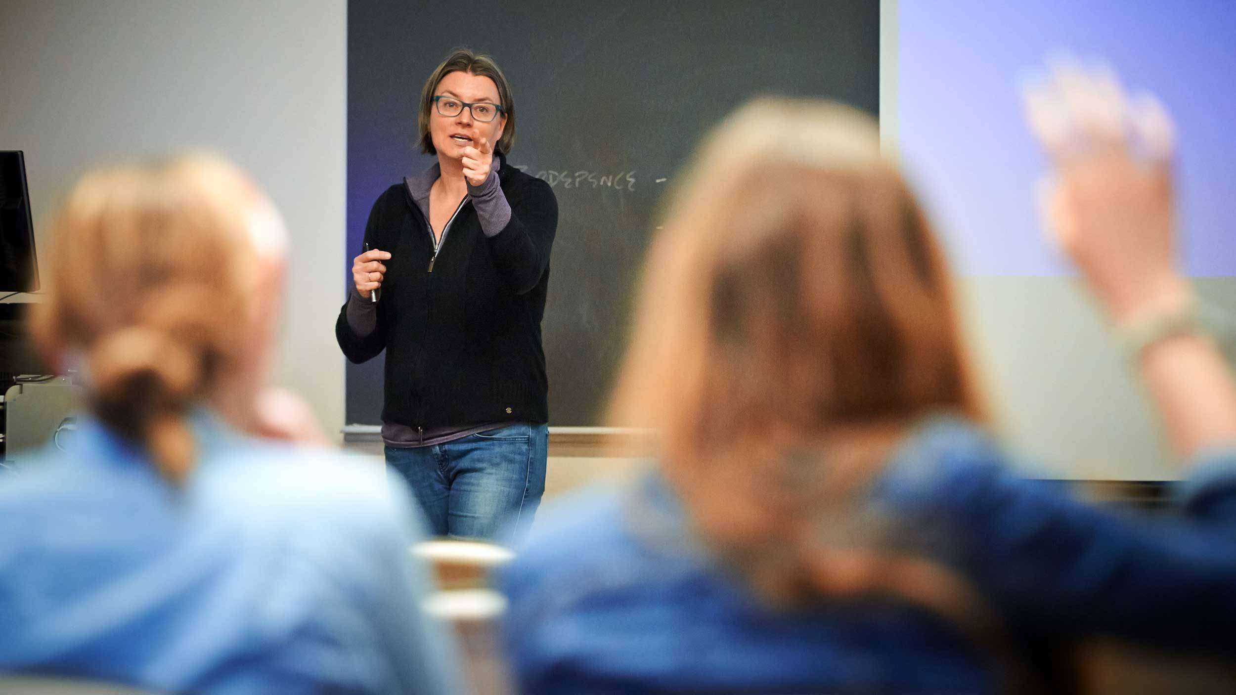 Prof. Susan Thomson speaks to students in a classroom