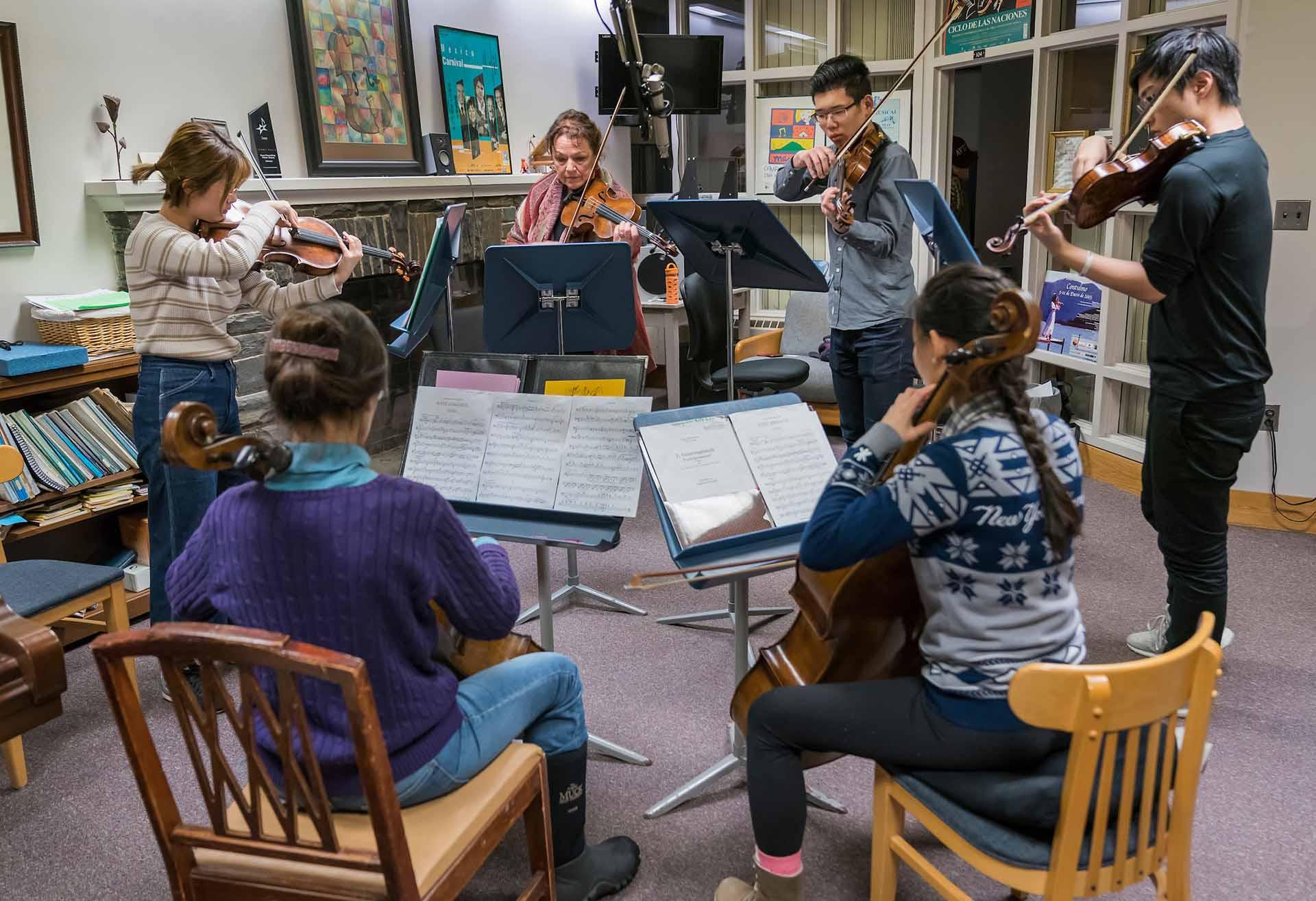 The Colgate Chamber Players rehearsing in small practice space.