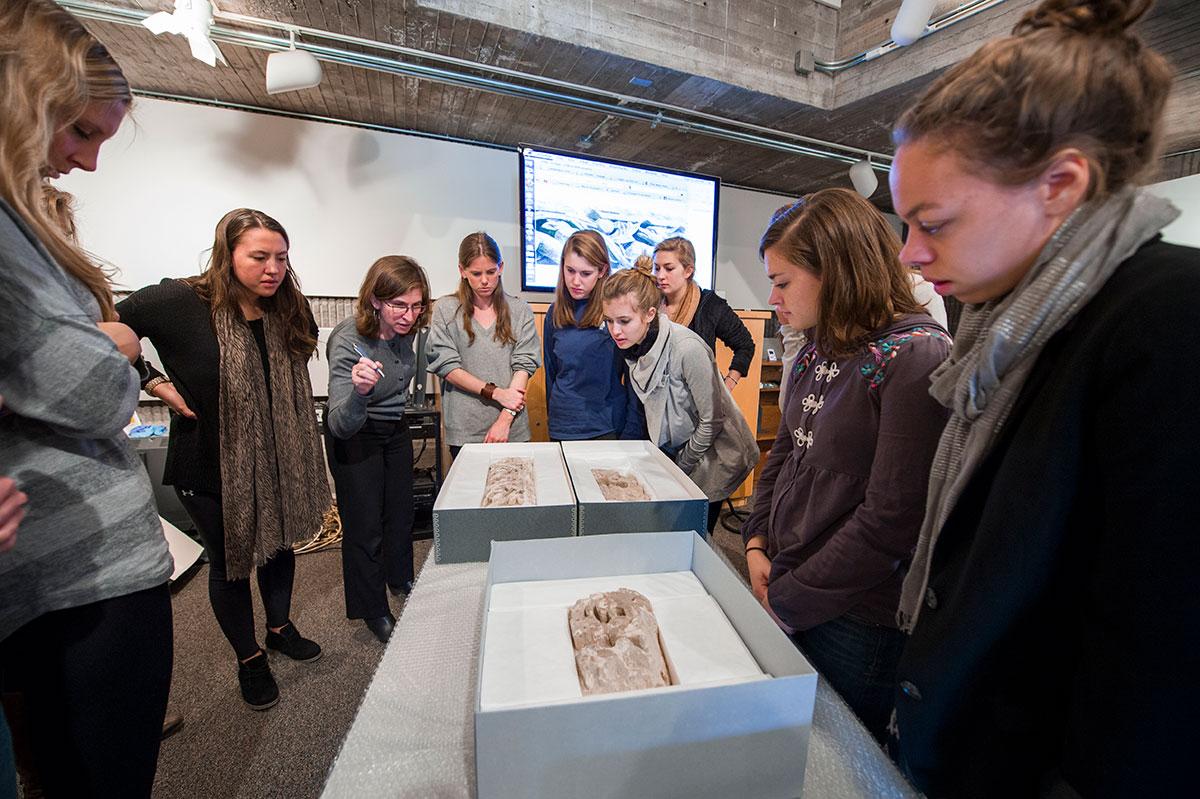 Professor Elizabeth Marlowe examines Egyptian artifacts in Colgate’s museums collection discovered to have never been exhibited.