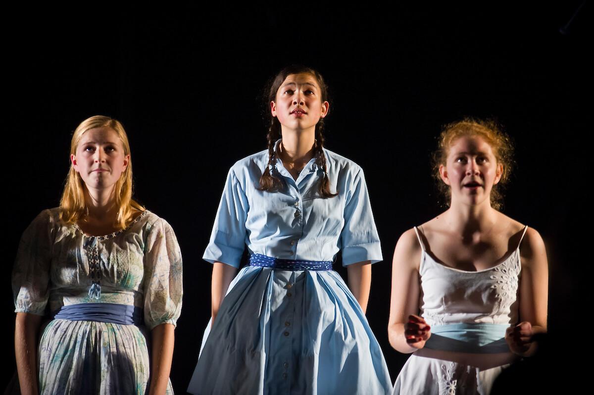 Students onstage for production of The World is Round Is Round Is Round