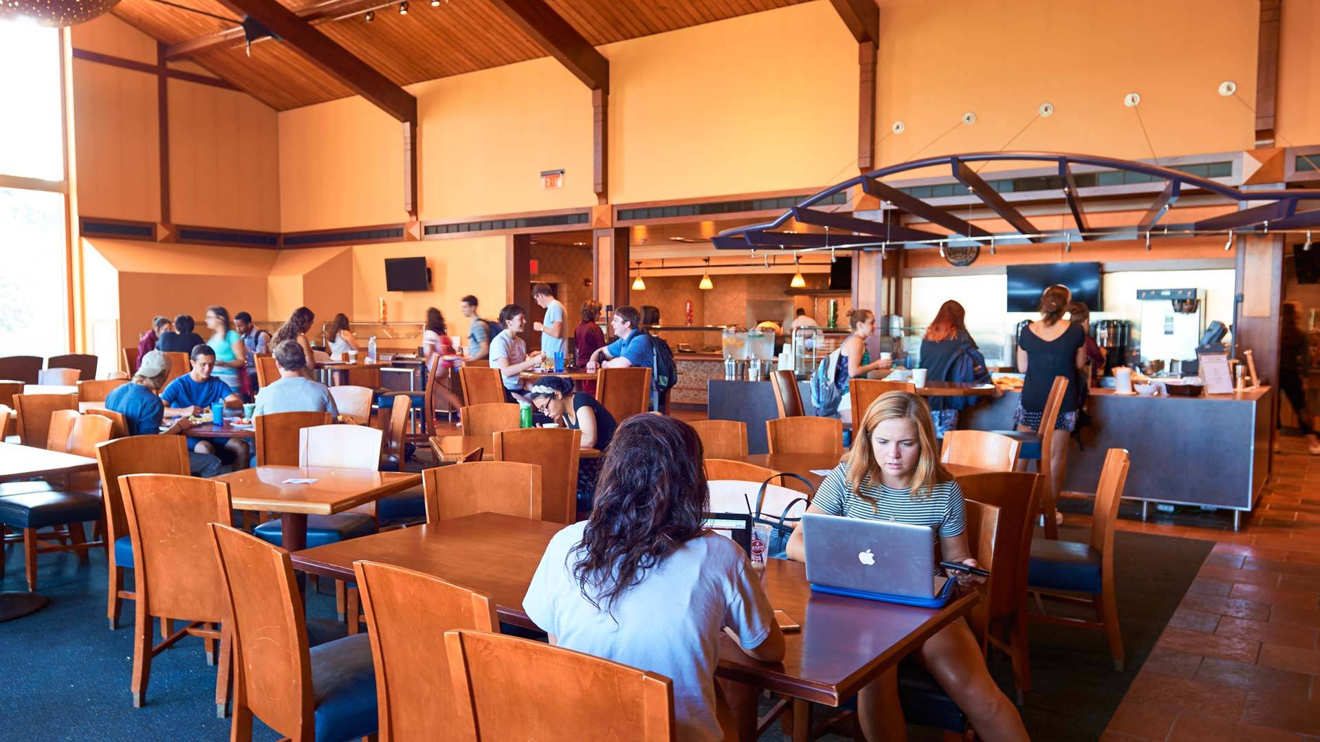 Students eat and study in the dining area of the Coop