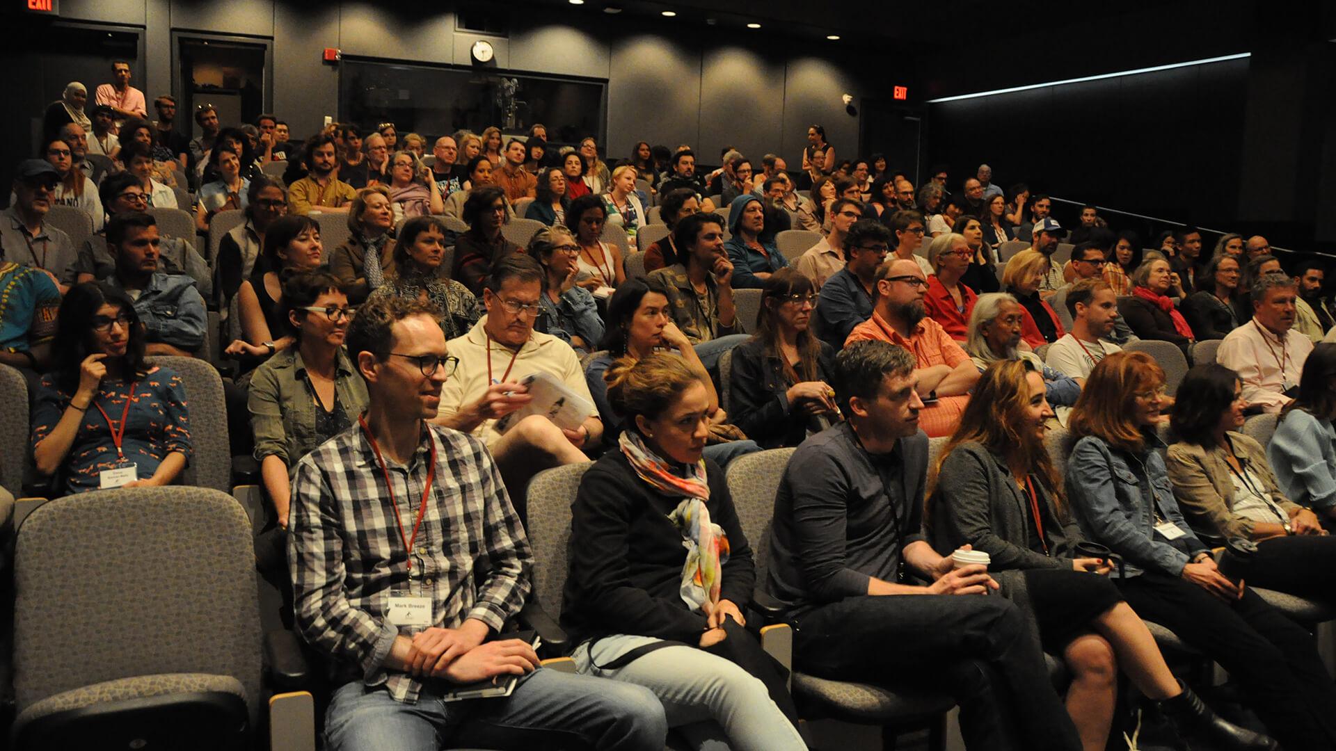 Screening attendees gather in the Golden Auditorium in Little Hall