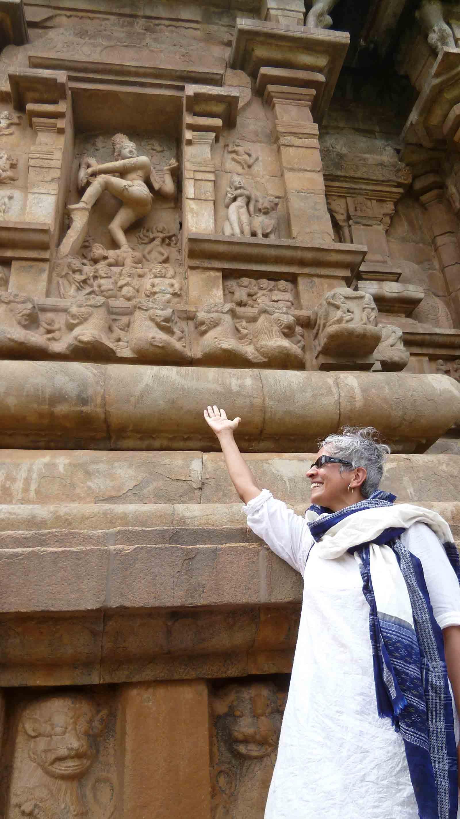 Professor Padma Kaimal gestures to a sculpted feature