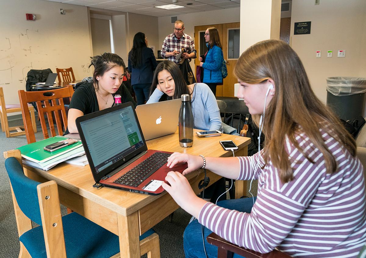 Students study in a residential lounge in East Hall.