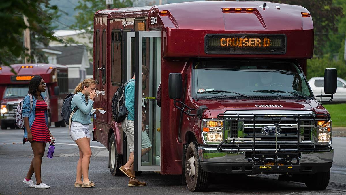 Students board the Colgate Cruiser on campus