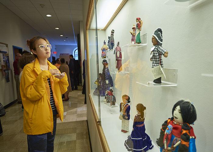 Student presents views exhibition of Indigenous dolls at the Longyear Museum of Anthropology