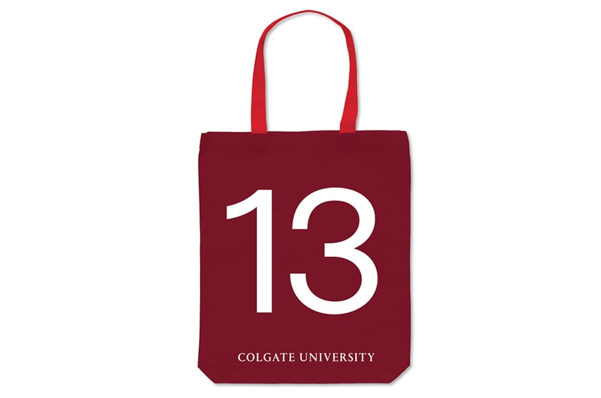 Maroon tote bag with a red handle