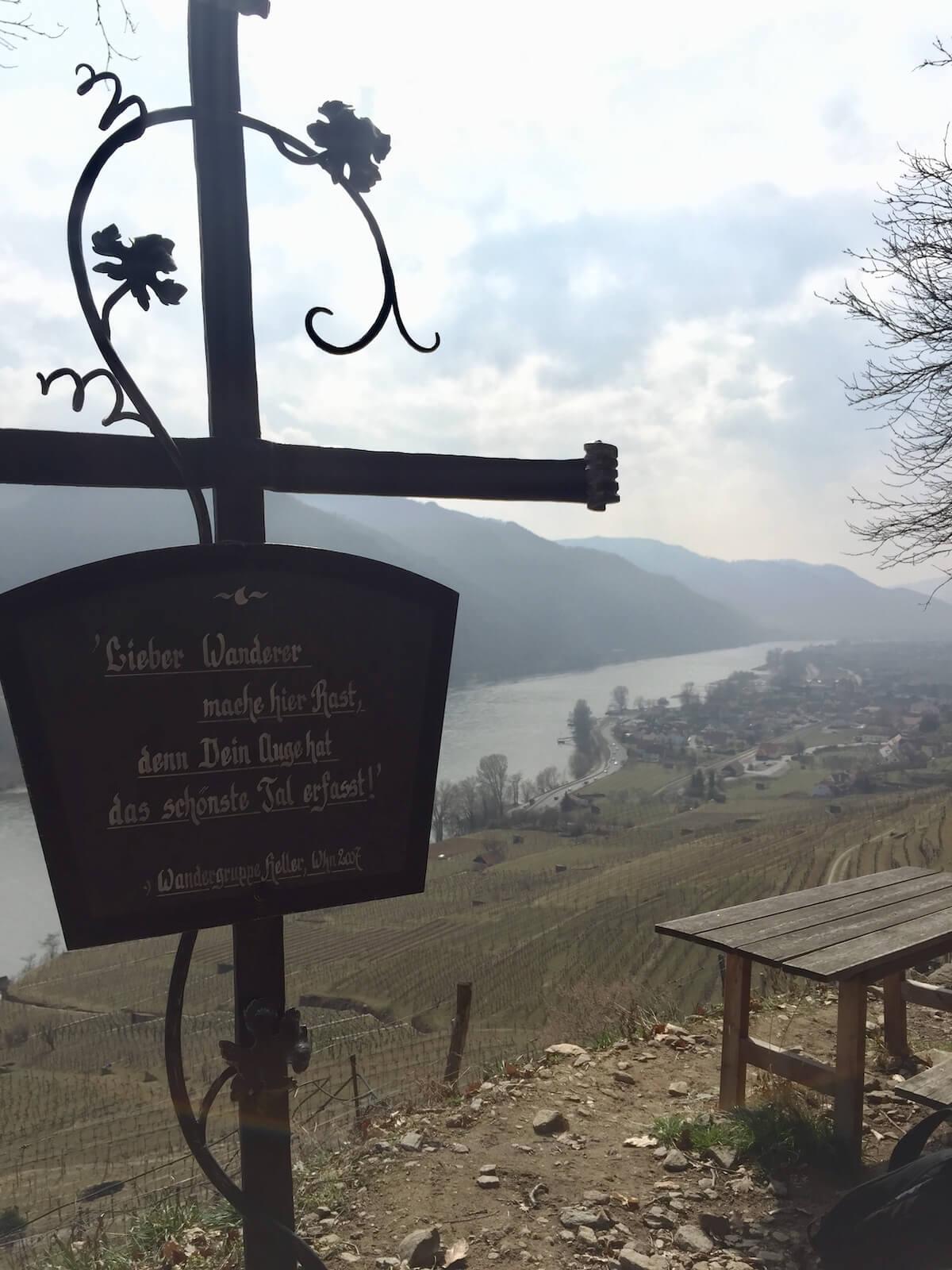 Sign in German overlooking a village
