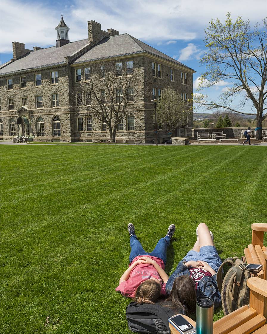 Students enjoy the spring weather outside on the Academic Quad