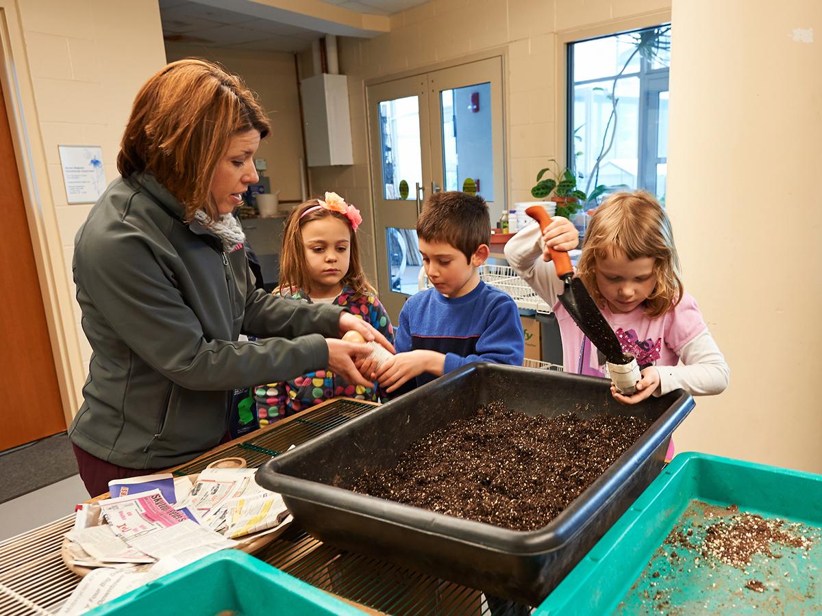 First-graders learn about plants at the Colgate greenhouse