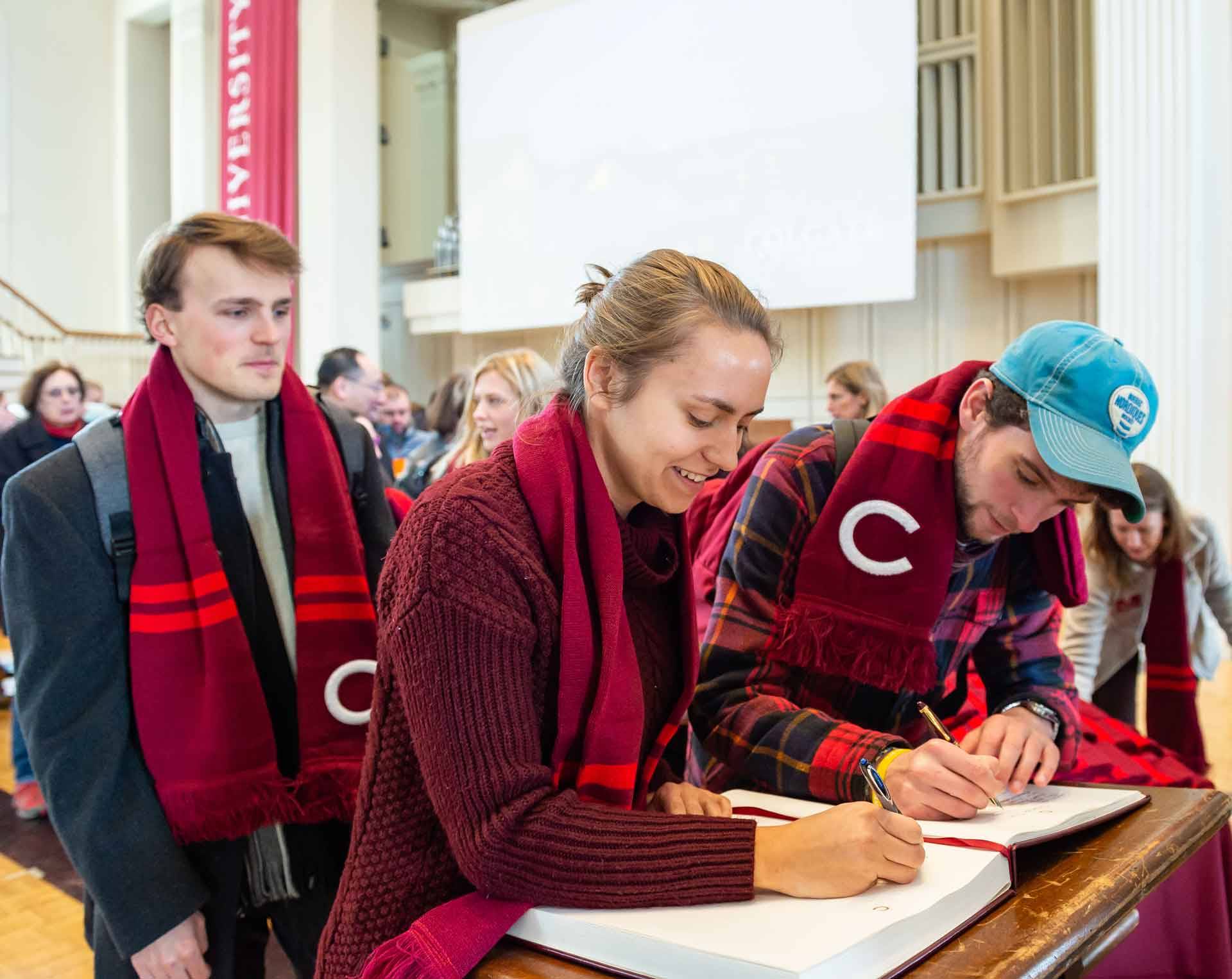 Jenny Lundt signs the Bicentennial book