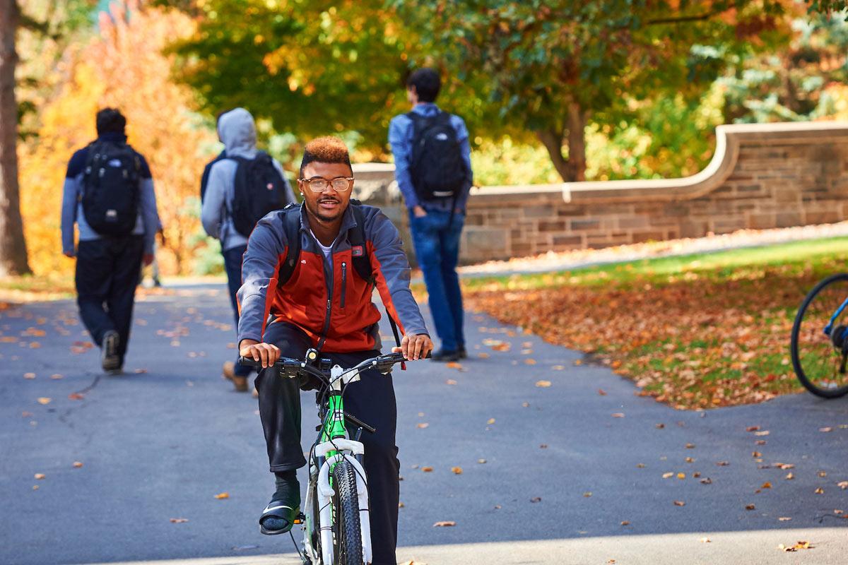 A student rides his bike to class.