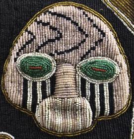 face in black and white beadwork