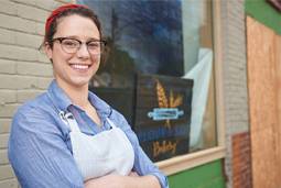 Britty Buonocore ’12 in front of Flour & Salt bakery