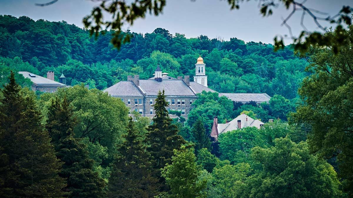 Colgate University through the trees.