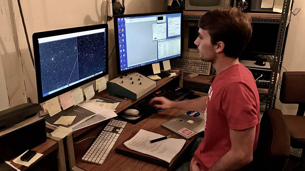 Jacob Pilawa processes data at a computer station