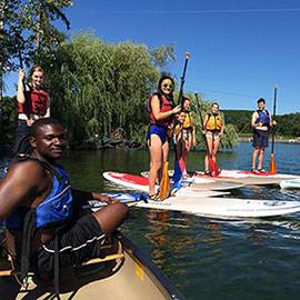 Colgate University student paddling canoe