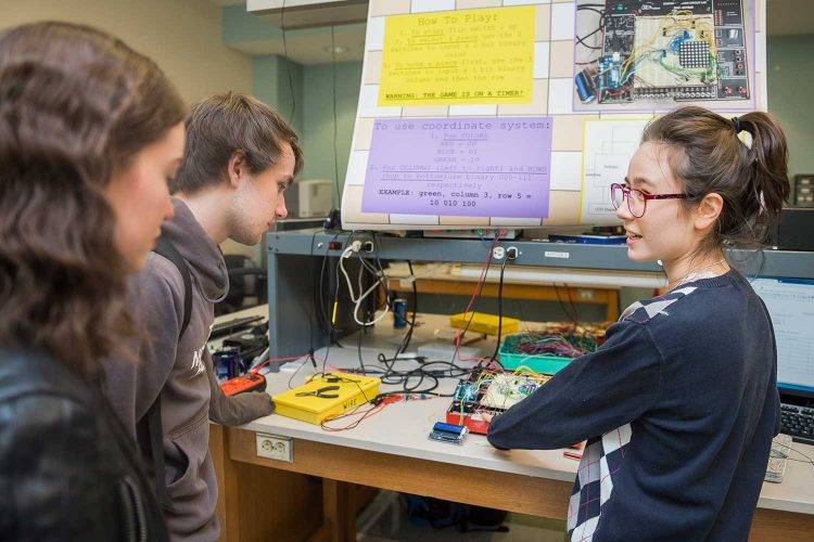 Alina Sabyr talks with fellow students 