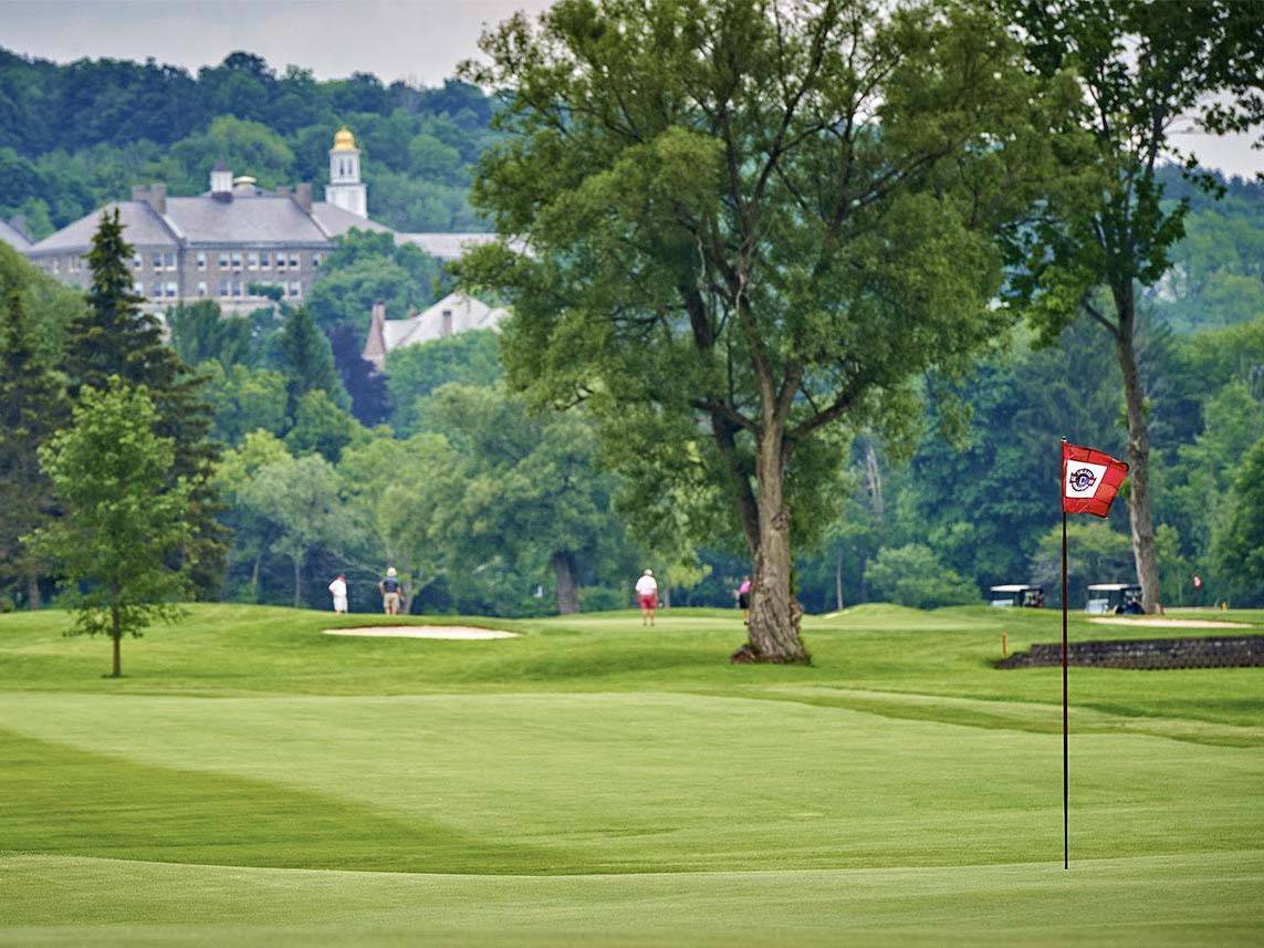 The grass on Seven Oaks Golf Course, with the Colgate campus visible in the background