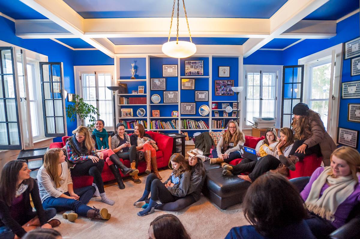 sisters of Gamma Phi Beta gather in their house