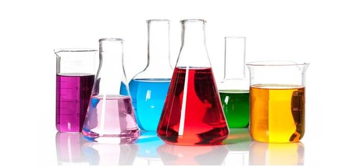 Assorted beakers filled with a variety of colored liquids.