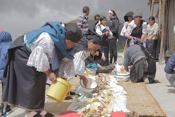 Women prepare a meal in Otavalo, Ecuador