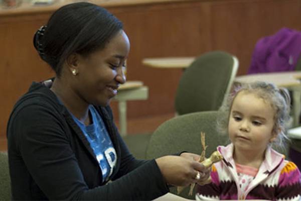 Colgate student working with small child