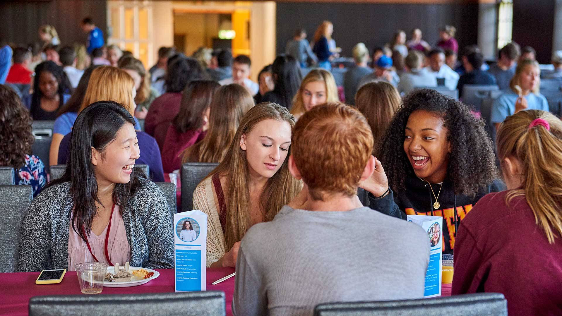 Students each brunch together in the Hall of Presidents during Orientation
