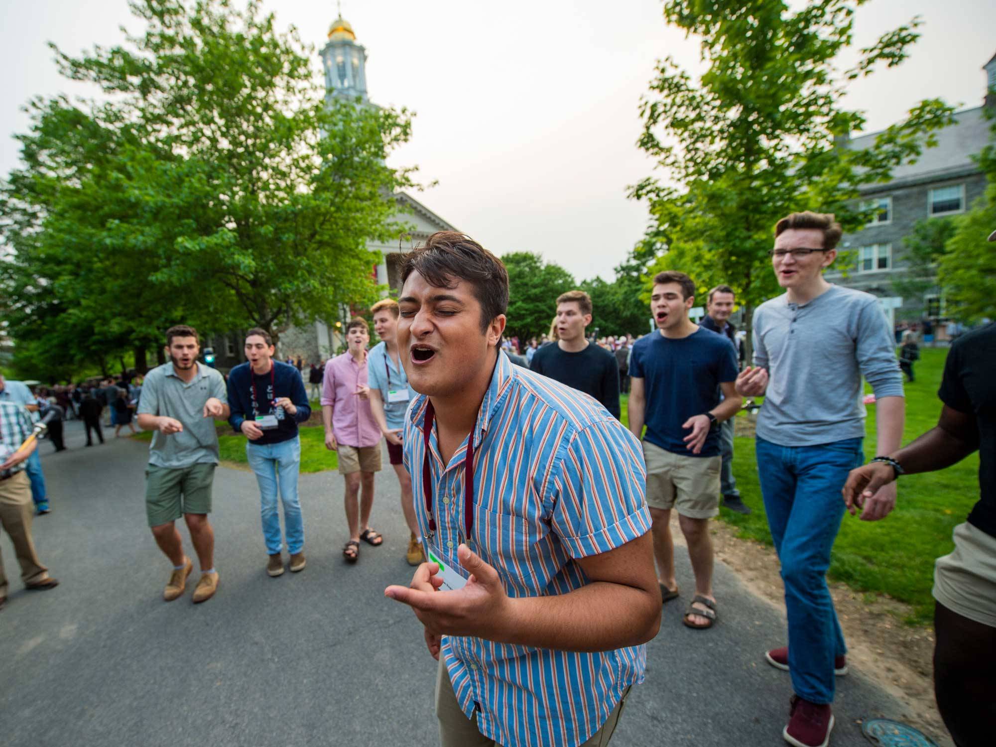 alumni sing during reunion