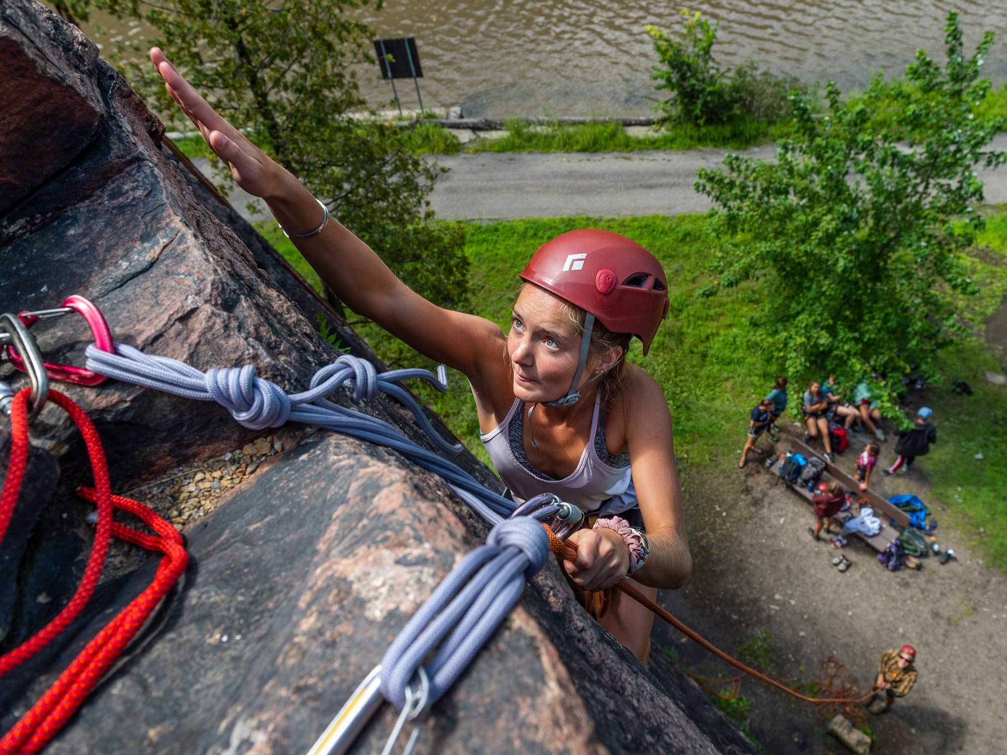 Kaitlyn MacDonald climbs rock wall
