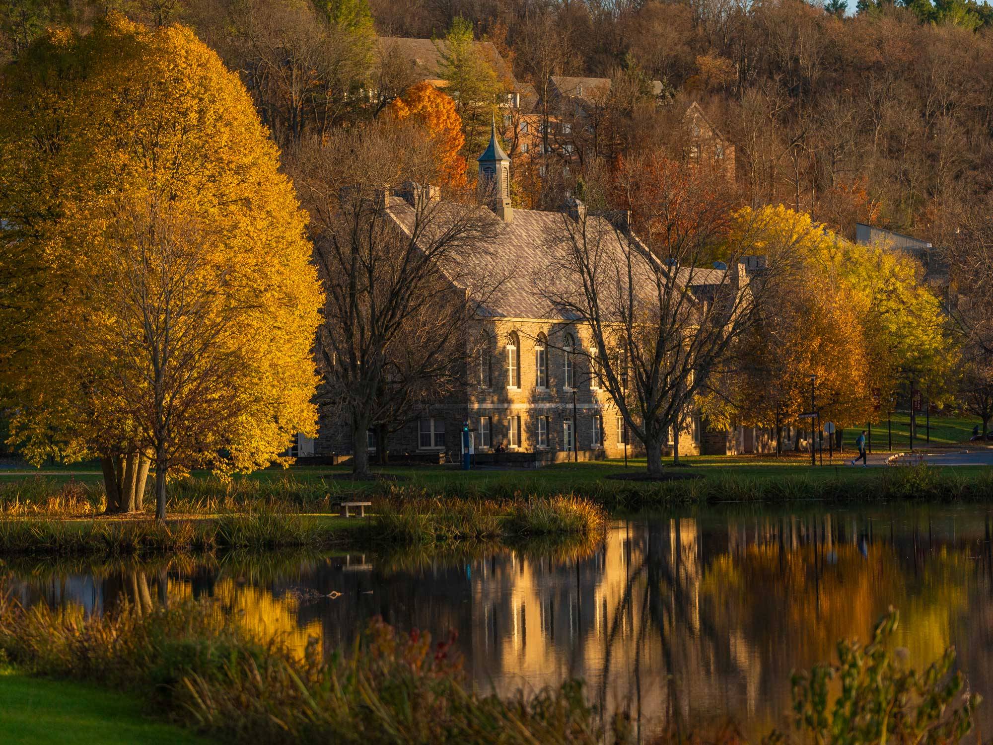 James C. Colgate Hall reflected in Taylor Lake