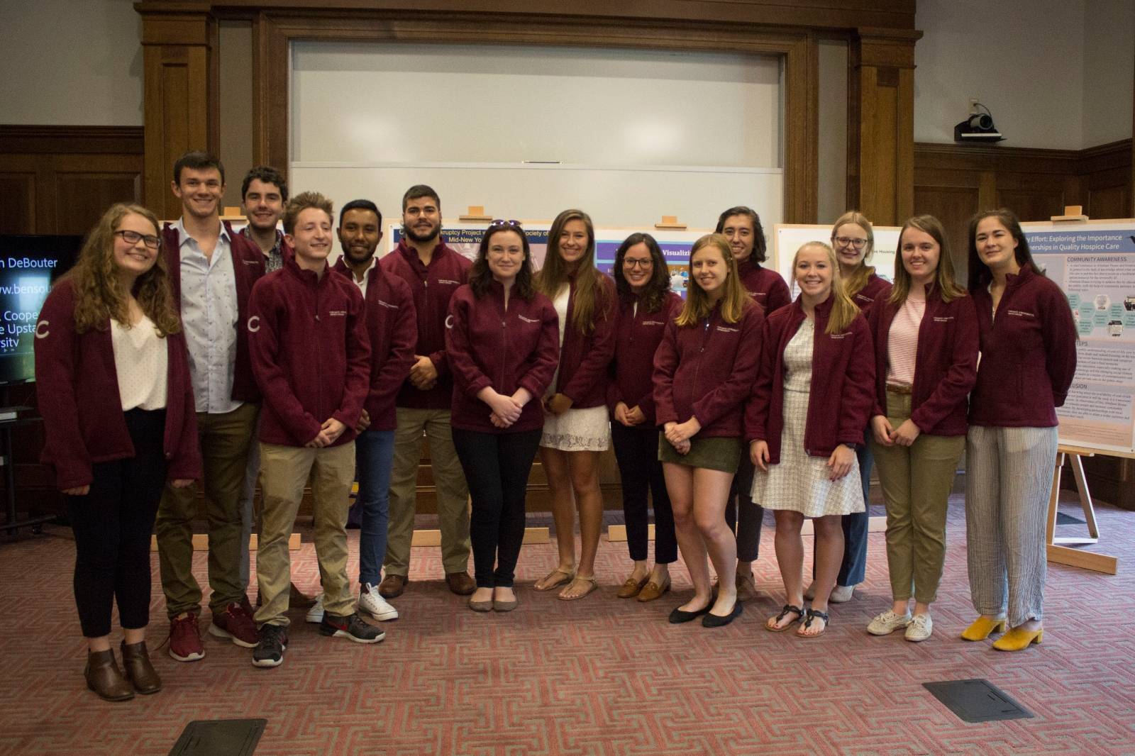 The 2019 Field School Fellows in front of their research posters