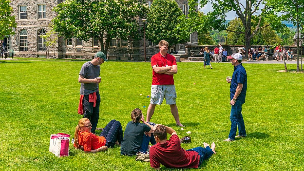 A group of old friends gathers on the Academic Quad at Reunion