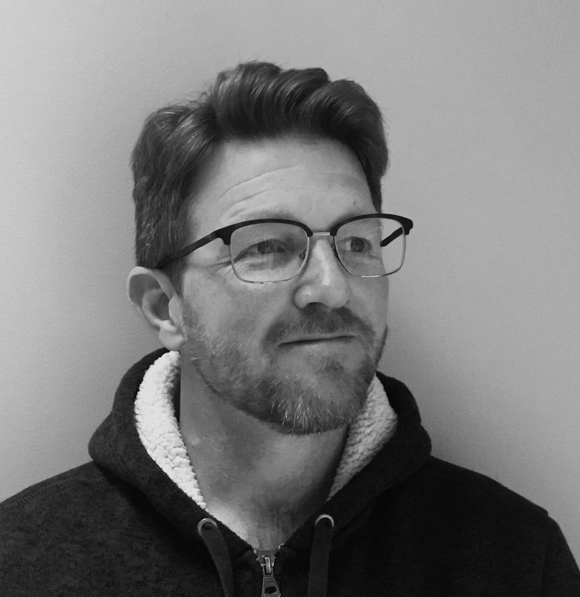 B&W photo of author Greg Bottoms