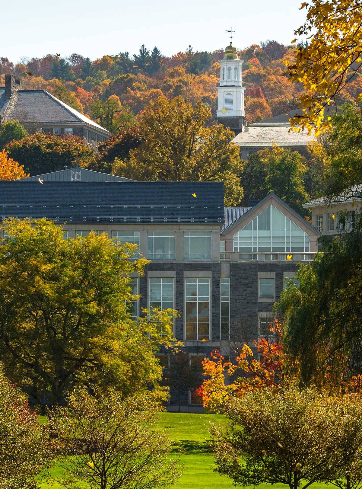 Memorial Chapel visible over Case library amidst fall foliage