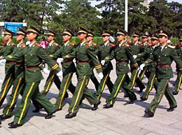 Soldiers march in Tiananmen Square.