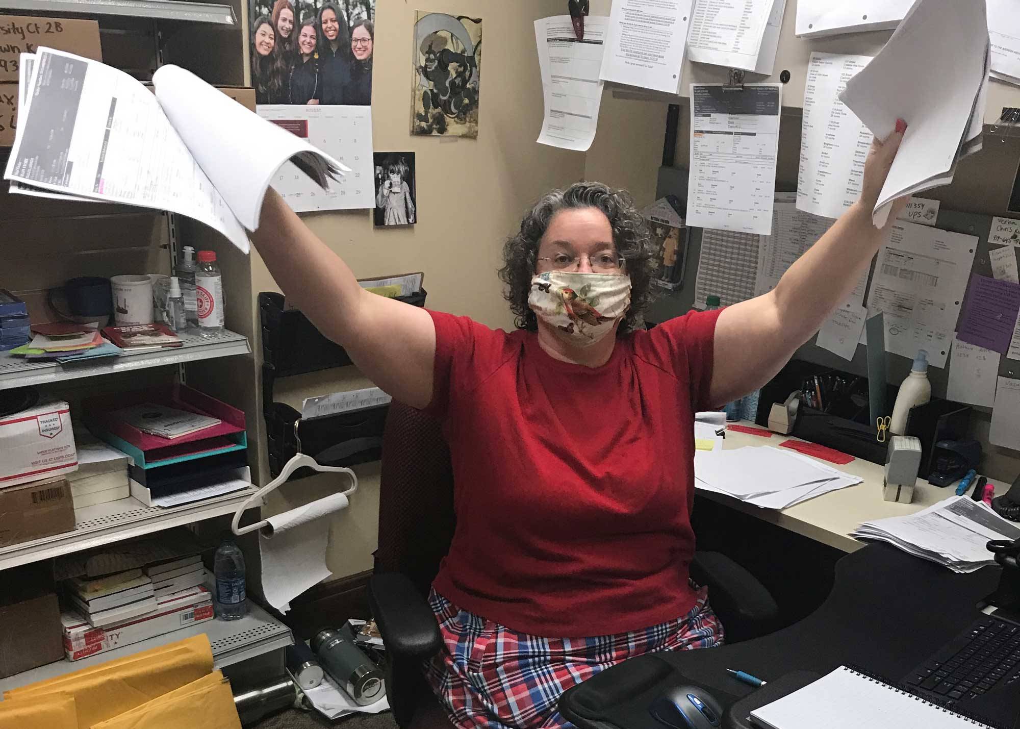 Anastasia Wells holds up bookstore delivery paperwork
