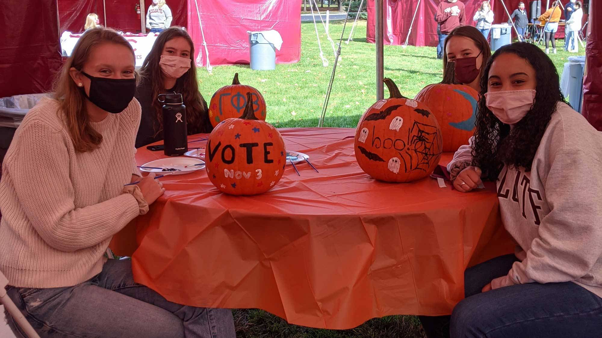 Students paint pumpkins during Fall Fest 2020