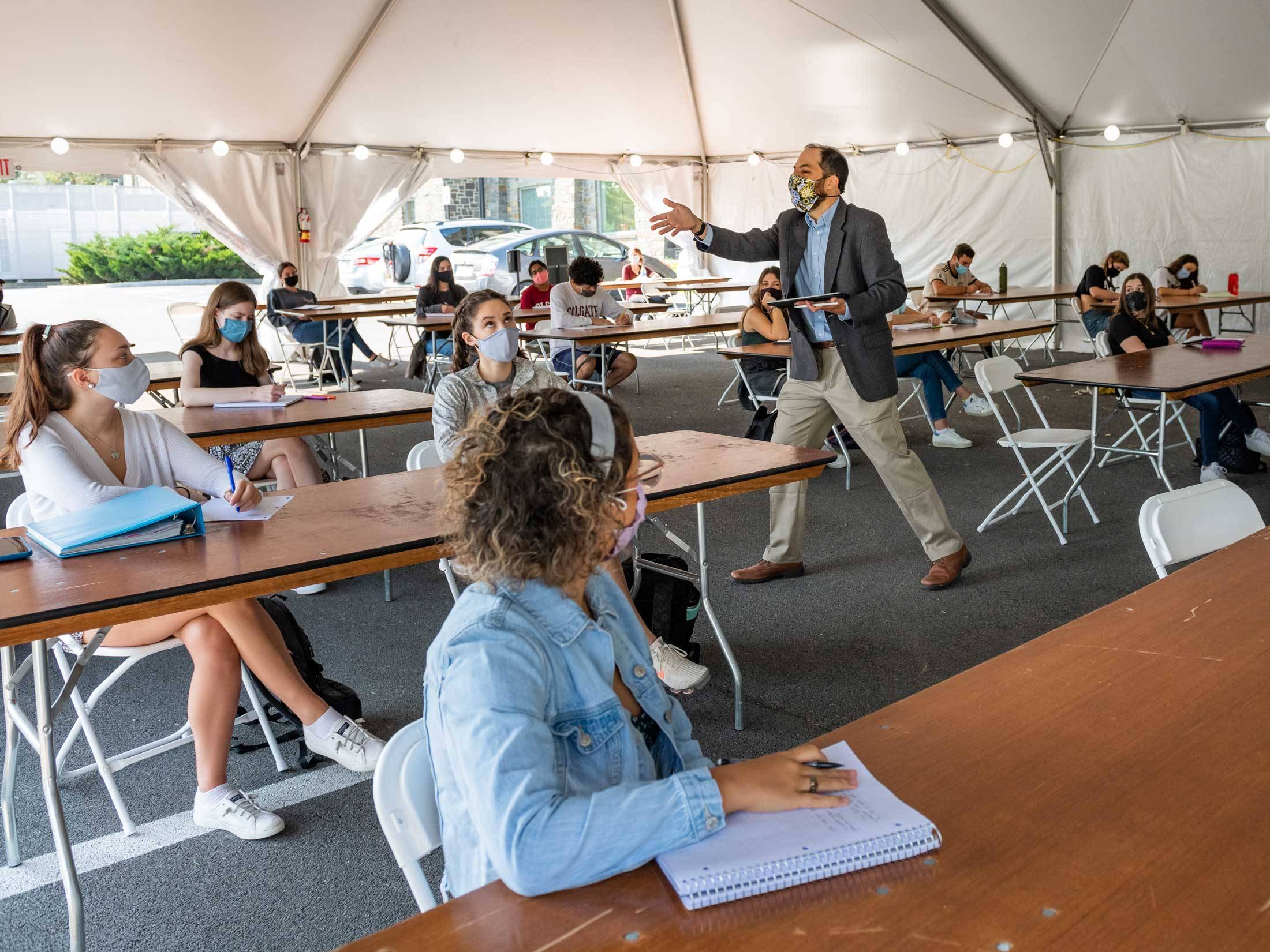 Students take class in tent