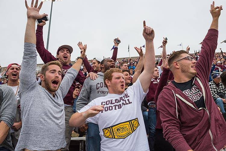 Student football fans cheer at a home football game