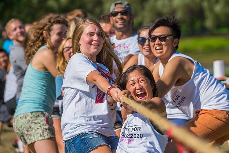 Students participate in a tug of war at Konosioni Field Day